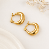Chunky gold teardrop hoop earrings for women with polished finish