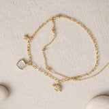 gold charm chain bracelet with star shell charms