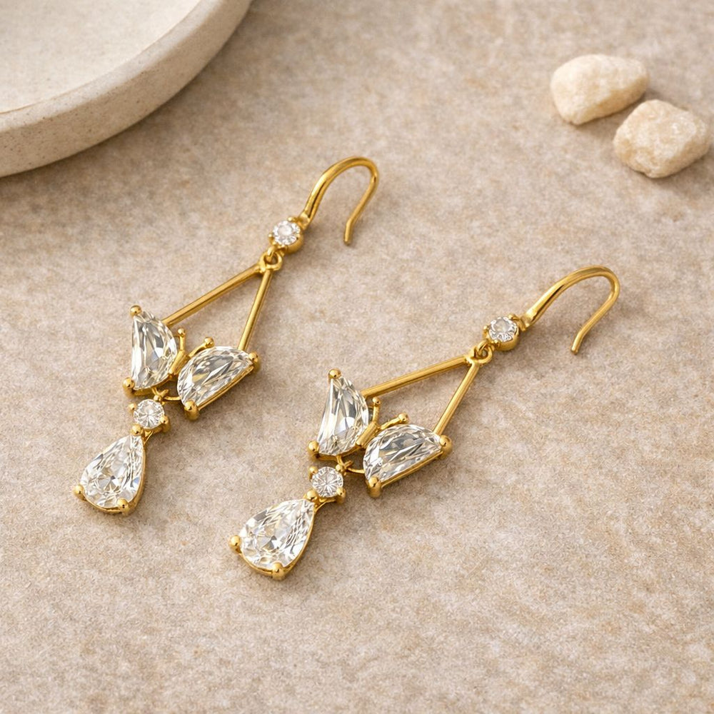 Elegant gold party wear earrings with sparkling crystal stones
