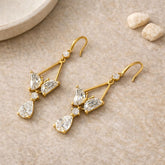 Elegant gold party wear earrings with sparkling crystal stones