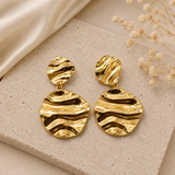 Gold sculptural statement earrings for women with wavy textured design
