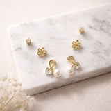Set of three gold stud earrings for women