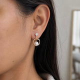 Elegant pearl and crystal drop earrings for party wear in gold finish