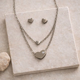 layered heart necklace set with crystal detail and stud earrings