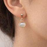 Elegant rose gold drop earrings with oval cat eye gemstone