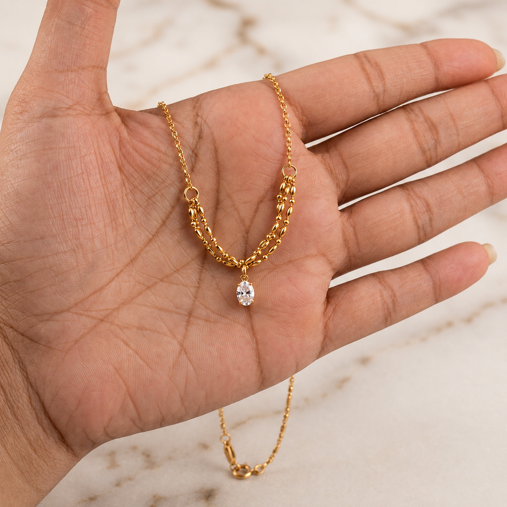 Celeste layered gold necklace with crystal drop pendant for women