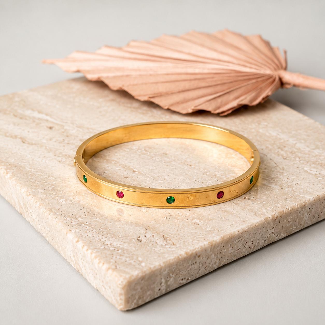 Gold gemstone bangle with ruby and emerald stones for women
