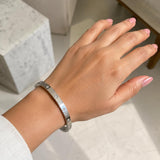 Minimal silver bracelet with sparkling crystal accents and sleek design