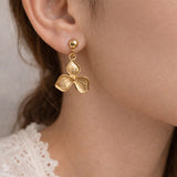 Stylish flower earrings gold textured design statement jewelry