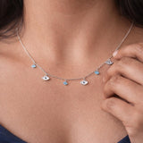 evil eye charm necklace with blue crystal details minimal protective jewellery