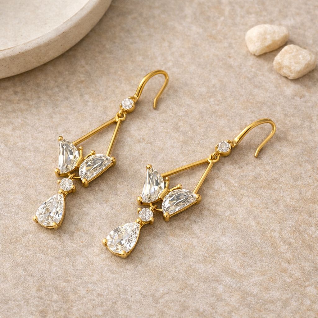 Elegant gold party wear earrings with sparkling crystal stones
