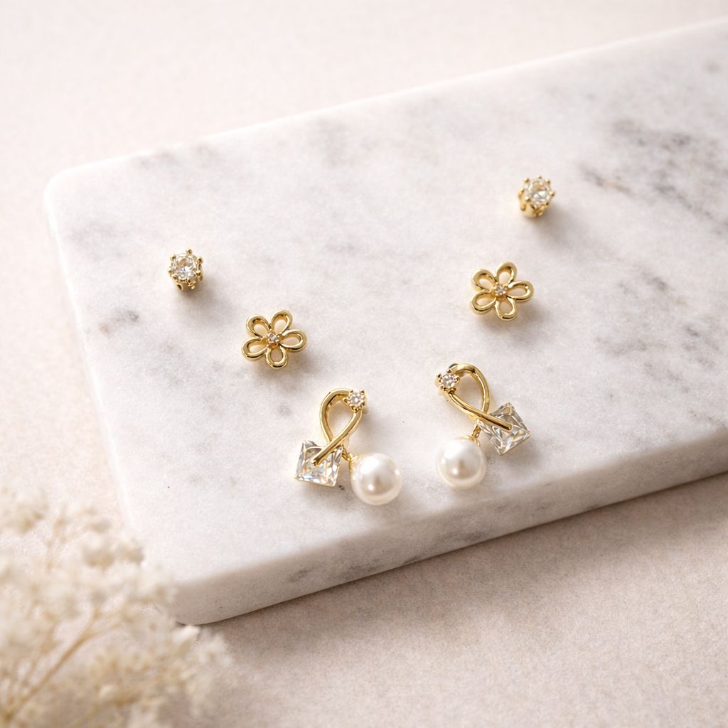 Set of three gold stud earrings for women