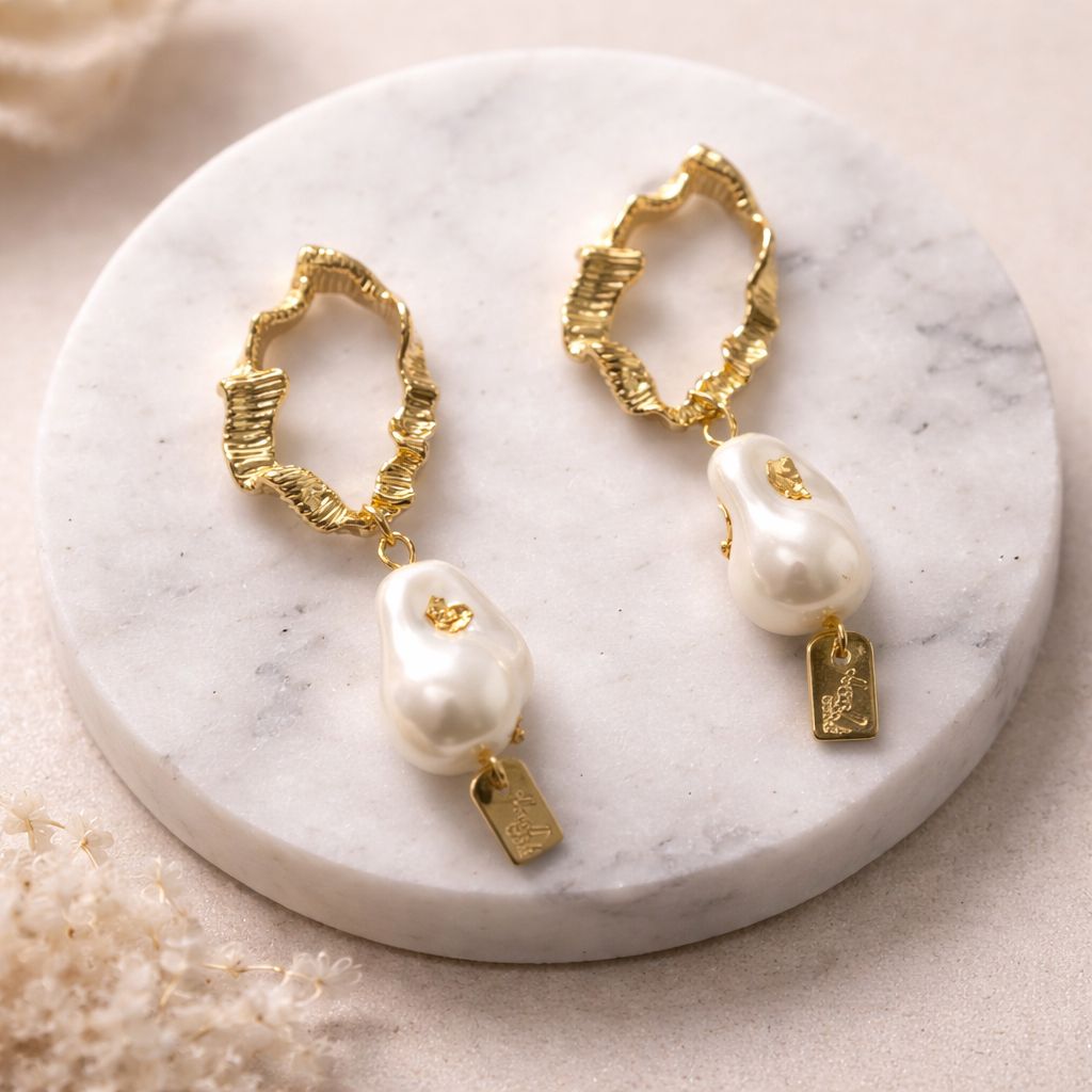 Elegant party wear pearl drop earrings with gold finish