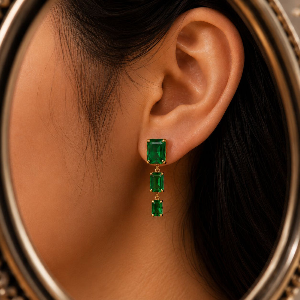 Gold-tone party wear earrings available in pink and green variants