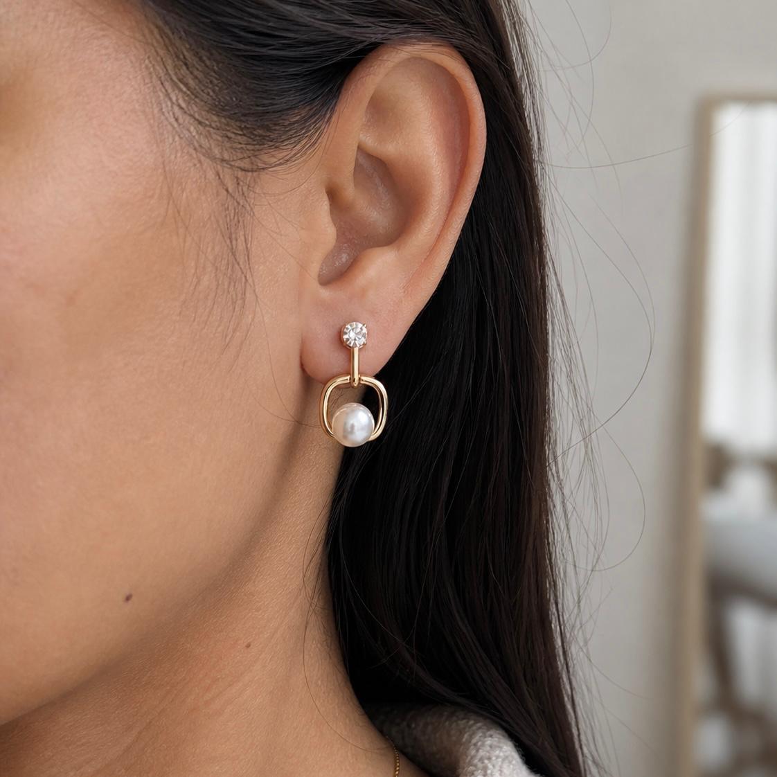 Elegant pearl and crystal drop earrings for party wear in gold finish