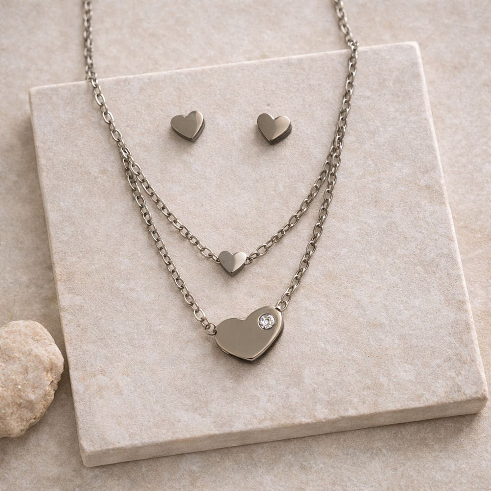 layered heart necklace set with crystal detail and stud earrings