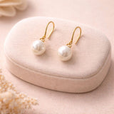 Elegant white pearl dangle earrings minimalist gold hook design