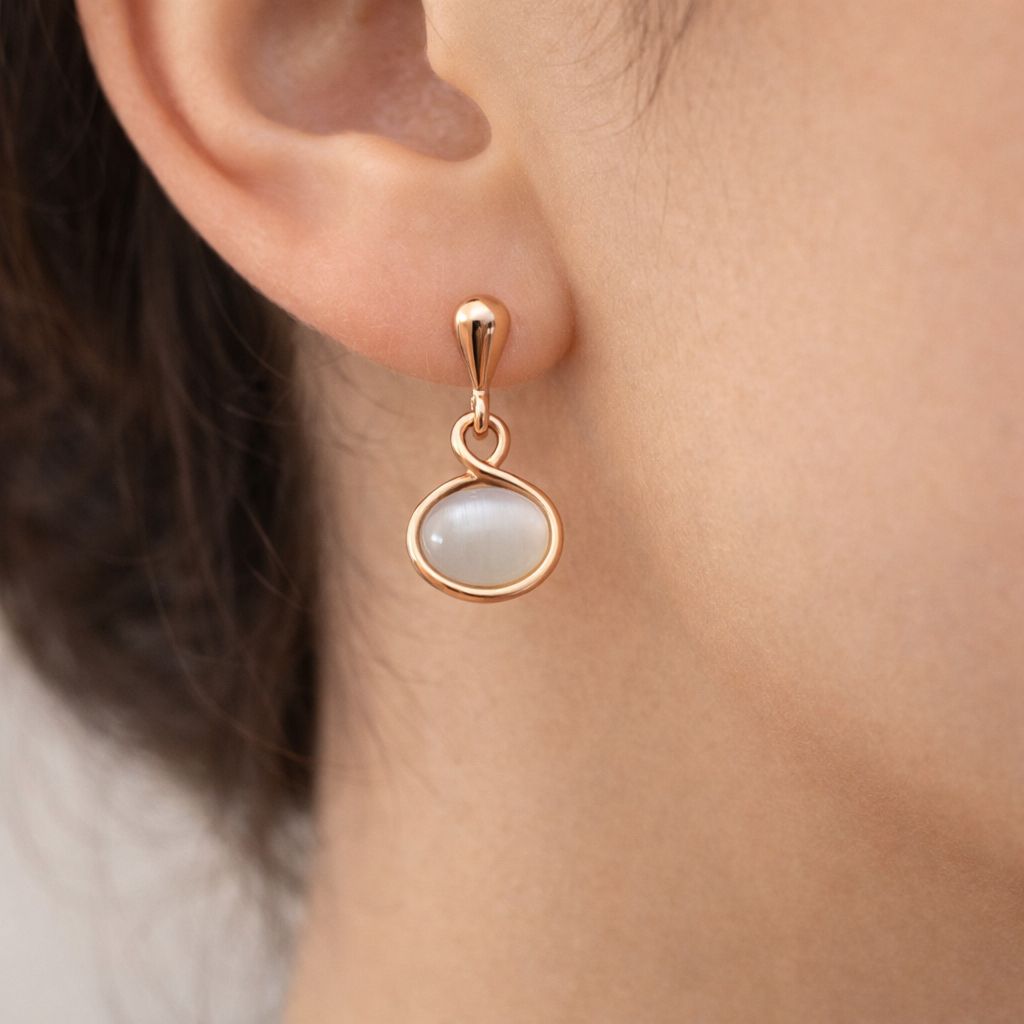 Elegant rose gold drop earrings with oval cat eye gemstone